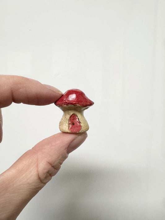 Handmade ceramic mini mushroom ornament for fairy garden and indoor plant decor.
